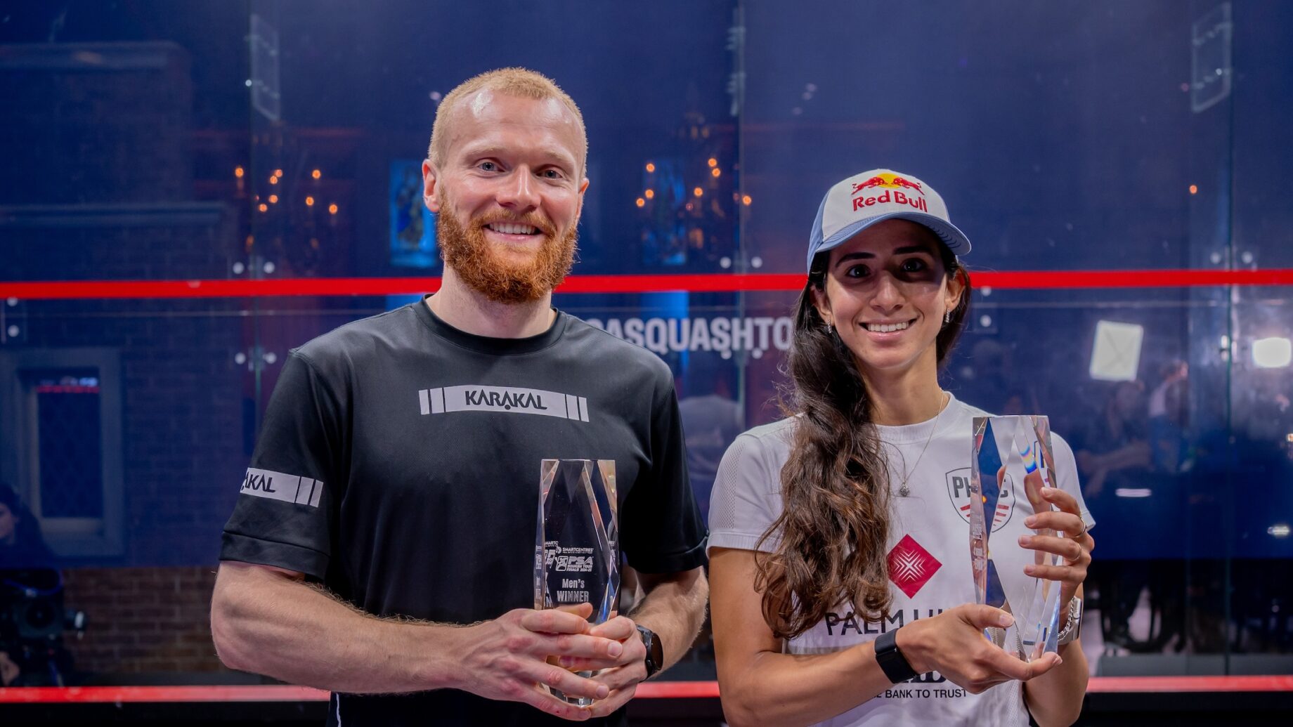 Joel Makin (left) and Nouran Gohar (right) with the 2024-25 PSA Squash Tour Finals trophies