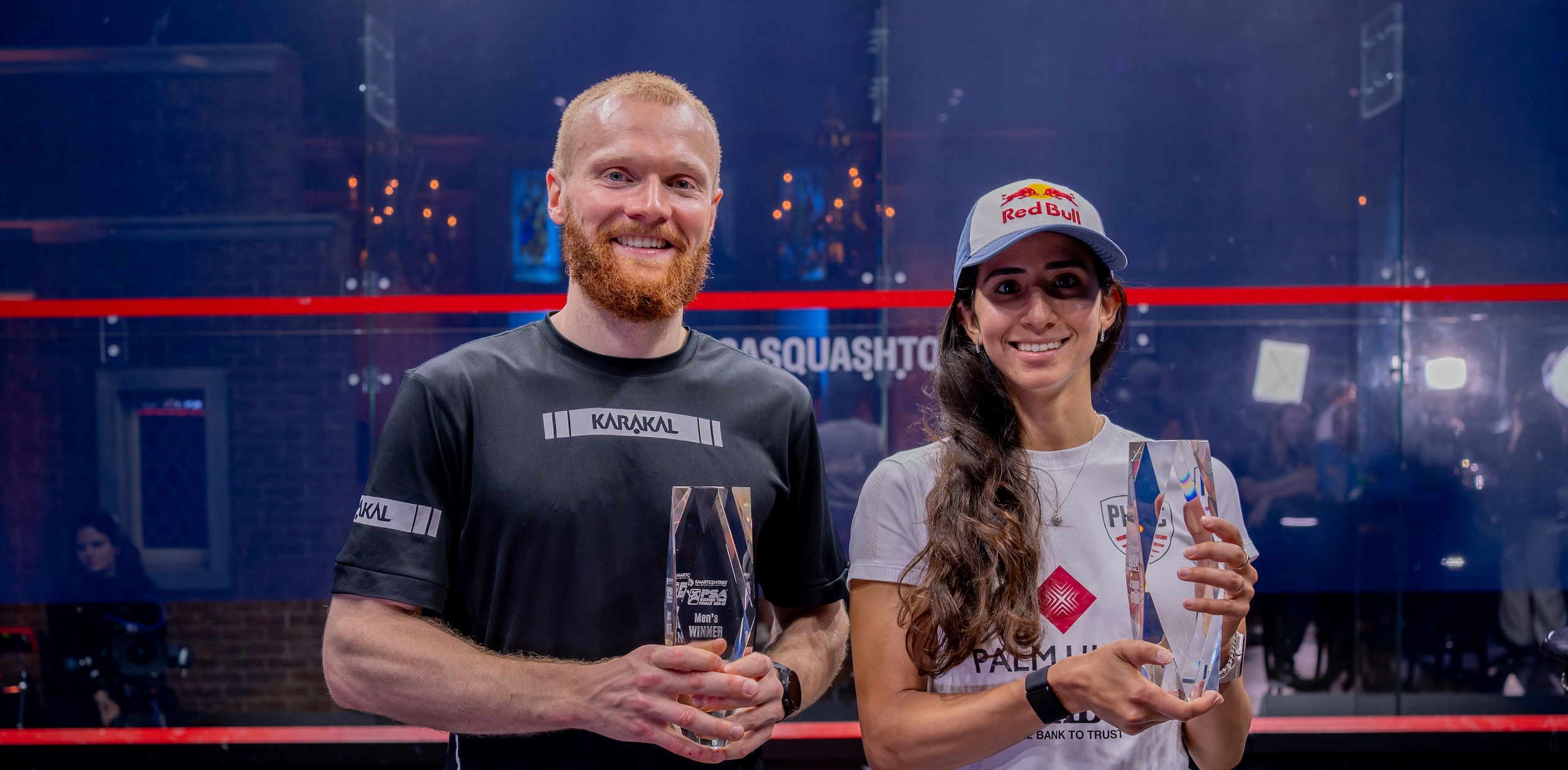 Joel Makin (left) and Nouran Gohar (right) with the 2024-25 PSA Squash Tour Finals trophies
